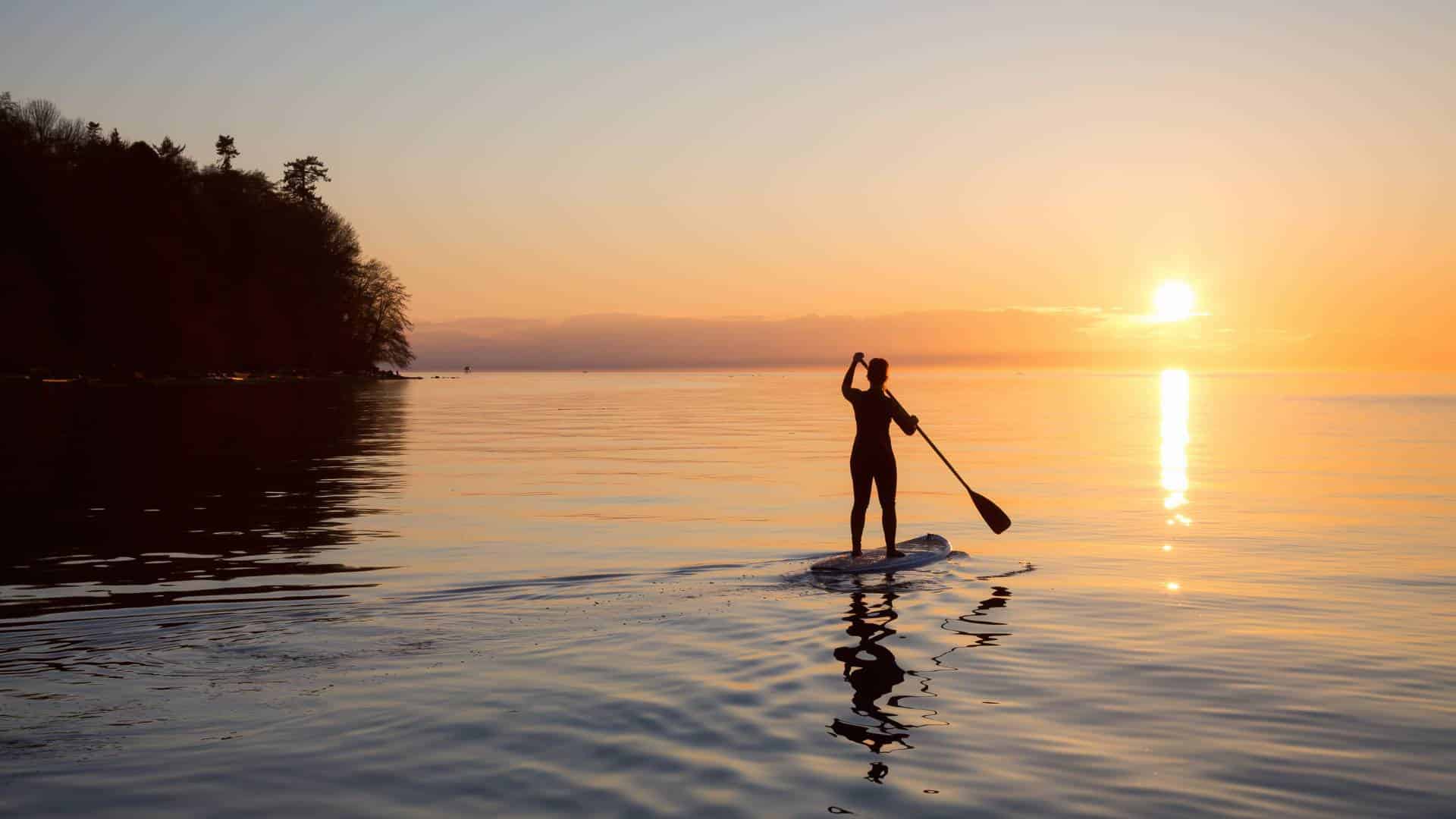 sunset paddle board